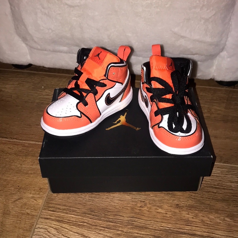Orange, black and white toddler Jordan’s. Brand new. Size 5c.